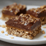 sliced chocolate oat bar with visible chocolate layer