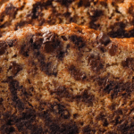 Moist chocolate chip banana bread recipe on a wooden board