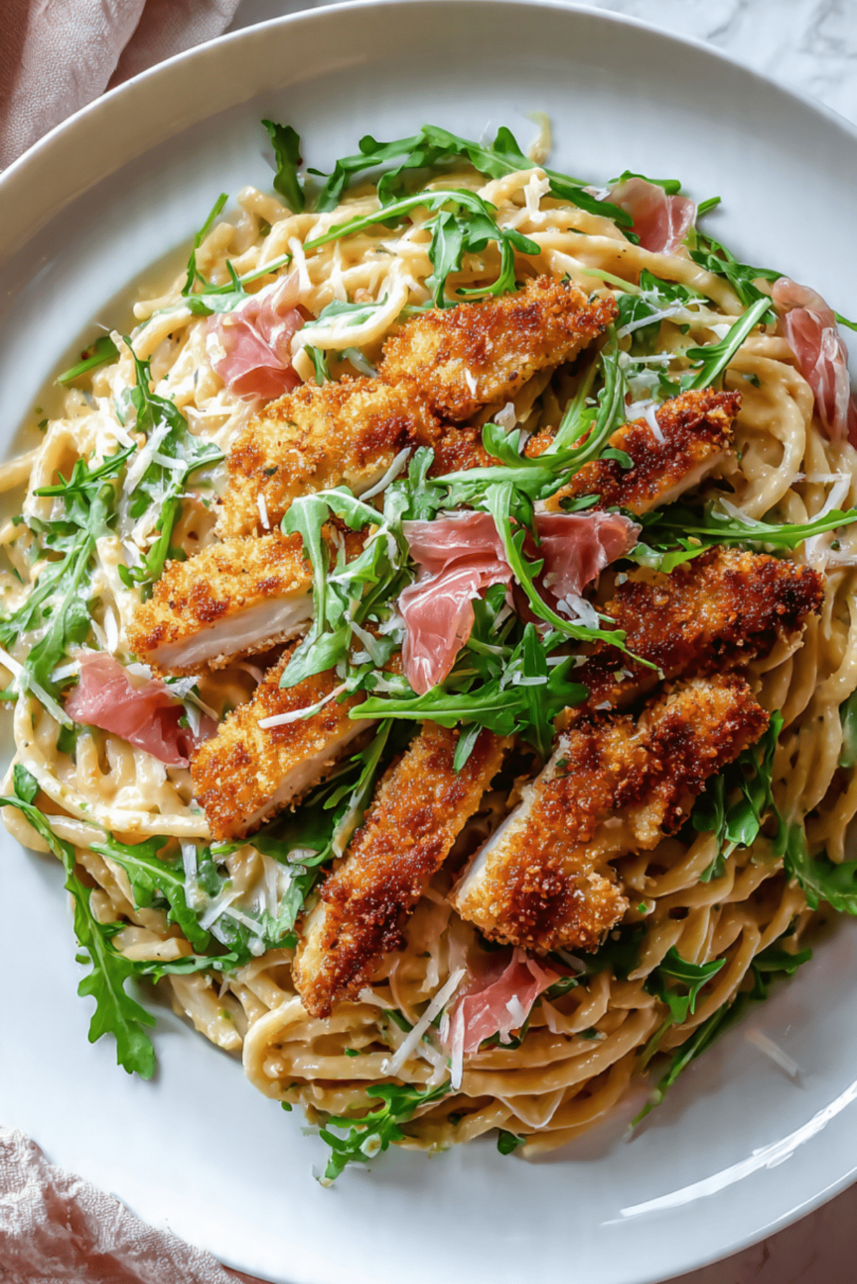 Basil Parmesan Pasta with Crispy Chicken, Prosciutto, and Arugula