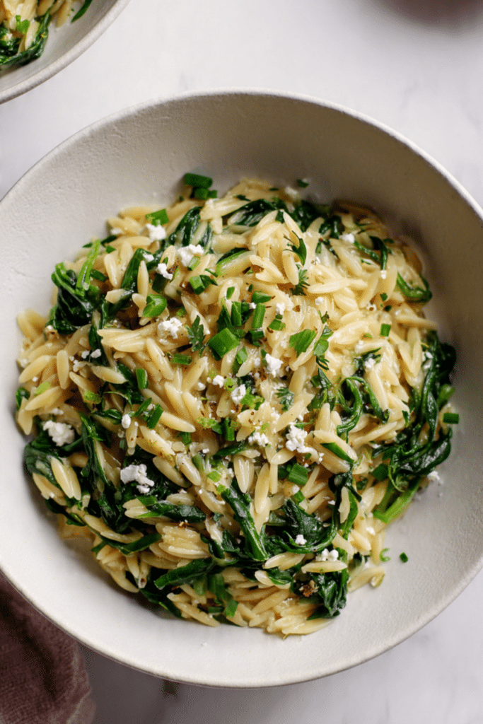 one pot orzo pasta with greens, herbs, lemon and feta